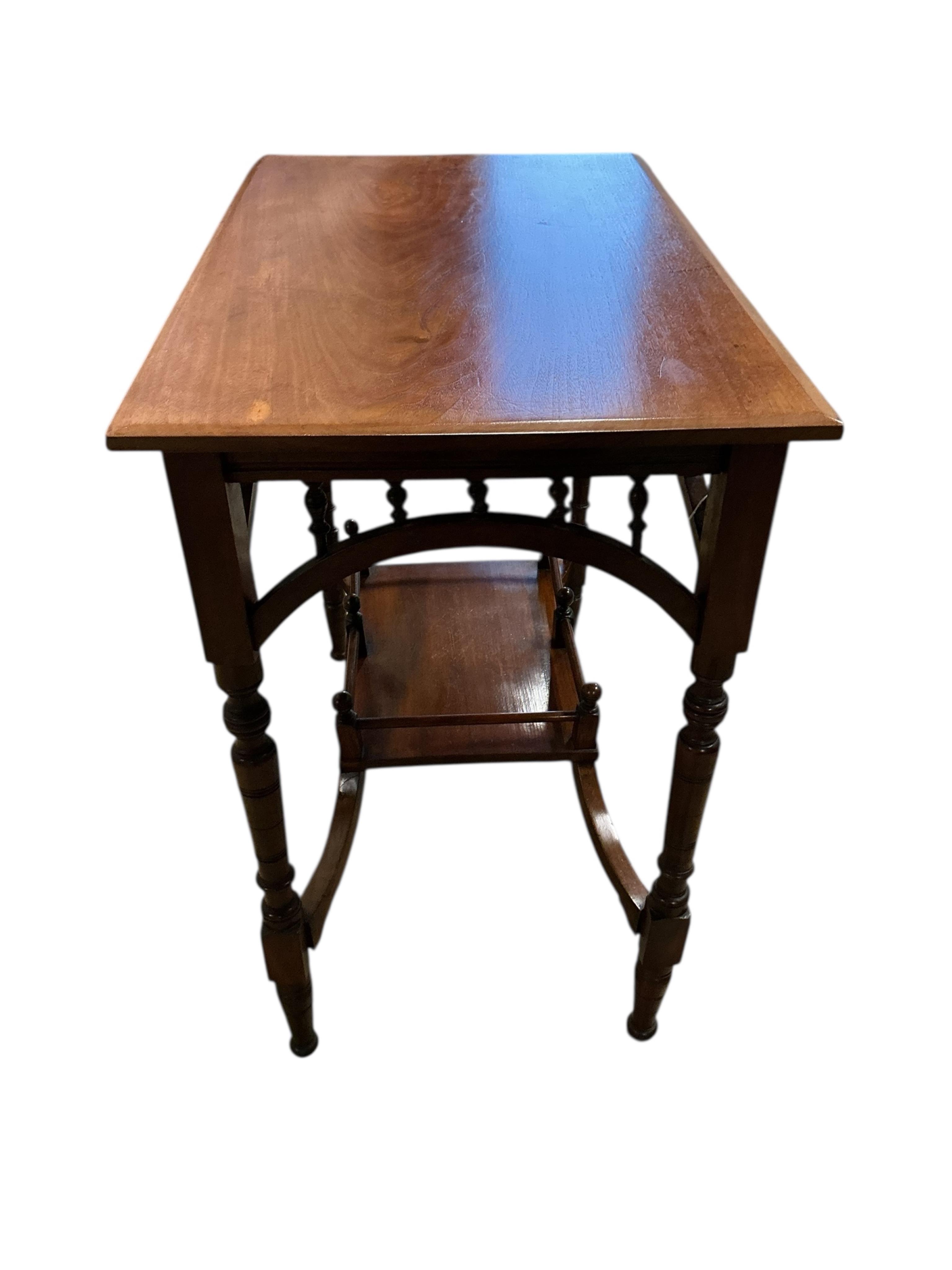 A Victorian Aesthetic Movement rectangular walnut two tier occasional table, width 74cm, depth 44cm, height 69cm